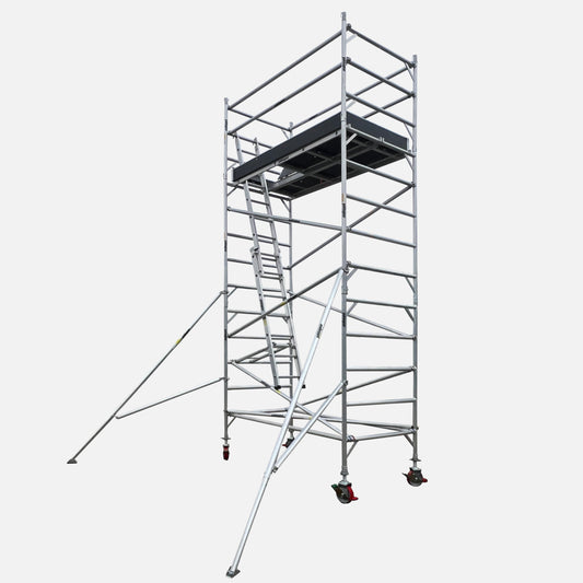 Yakka Gear aluminium mobile scaffold tower with 6.6m reach and 1.3m wide double platform setup, shown against a white background. Features two 0.74m wide marine plywood platforms placed side by side, a single internal access ladder, guard rails, diagonal and horizontal braces, stabilisers, 8-inch adjustable caster wheels, and toe boards—providing a spacious and stable elevated work surface.