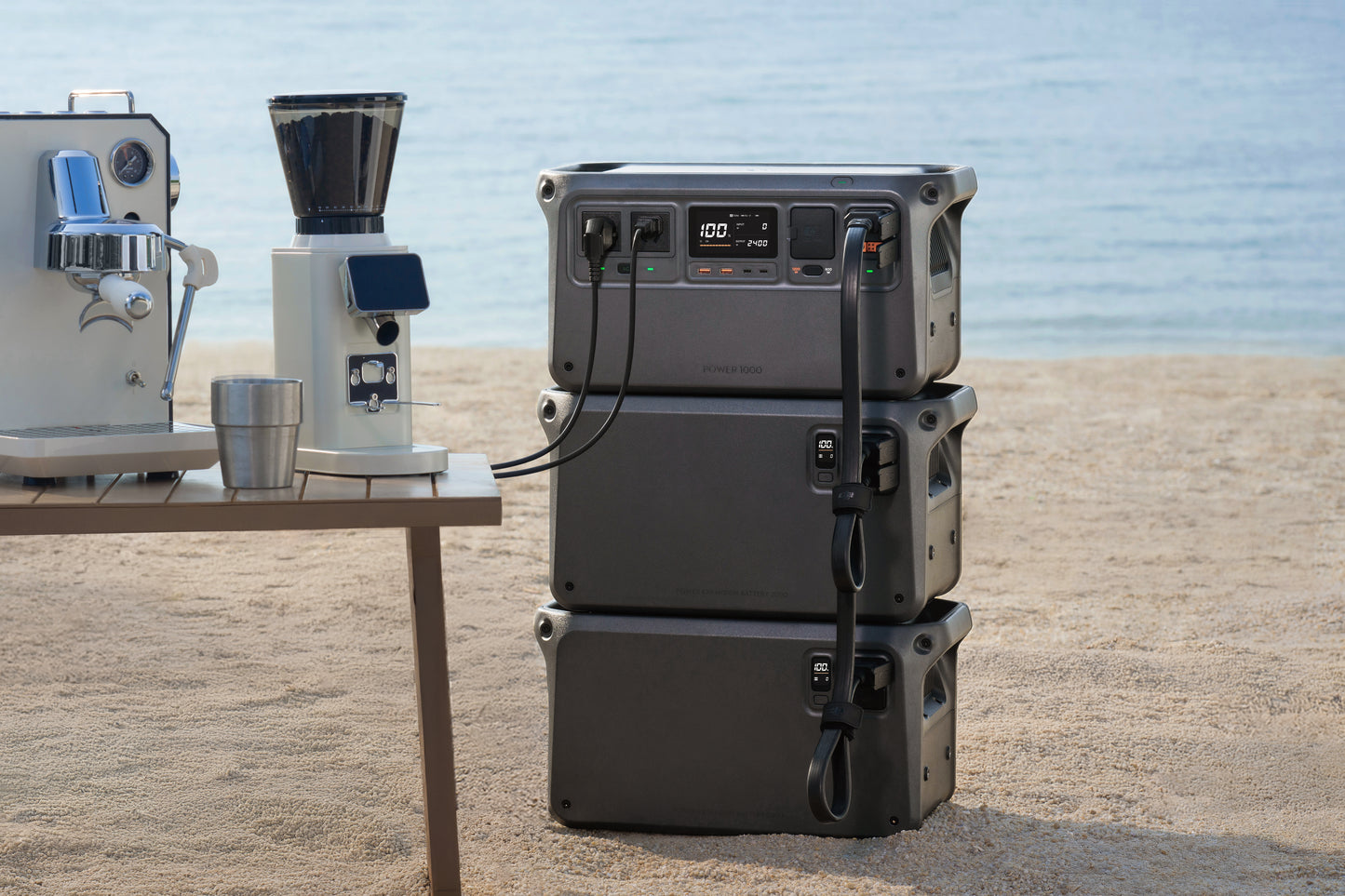 DJI Power Expansion Battery 2000 High Output 2400W powering a beachside coffee machine setup — portable, high-output battery delivering reliable off-grid energy for mobile cafes, tradies, and outdoor events; available from Yakka Gear