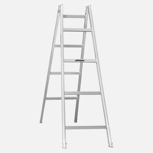 Side view of the 2.4m–2.7m aluminium trestle with 4 alternating rungs and adjustable legs, built for tradies, stable on uneven floors, and used with planks for elevated work, Yakka Gear Australia.