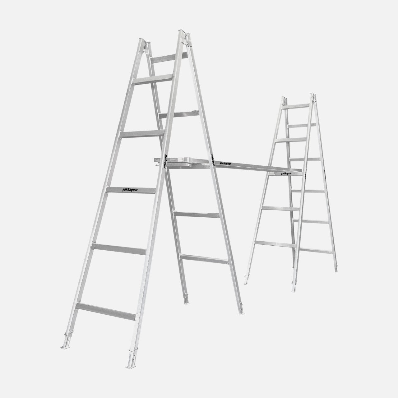 Side angle of a pair of 3m–3.3m aluminium trestles with 5 alternating rungs and adjustable legs, supporting two planks spanning across and locked securely in place with plank clamps, designed for tradies, Yakka Gear Australia.