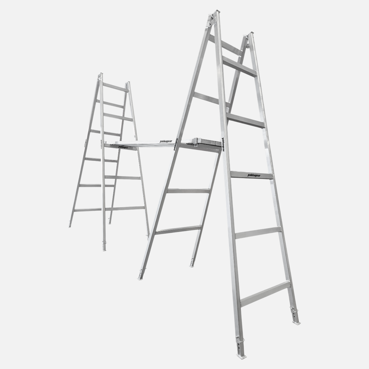 Pair of 3m–3.3m aluminium trestles with 5 alternating rungs and adjustable legs, supporting two planks spanning across and locked securely in place with plank clamps, designed for tradies, Yakka Gear Australia.