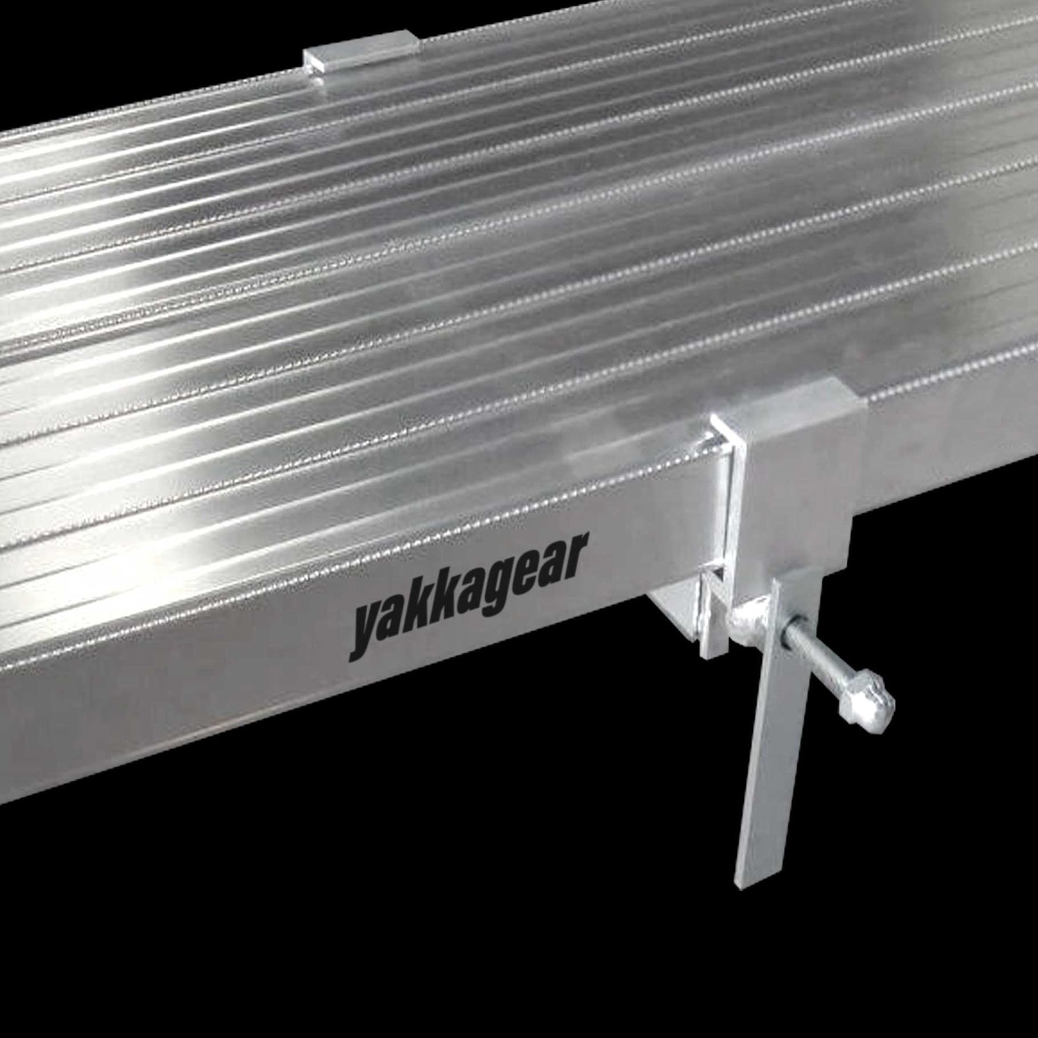 Yakka Gear Australia Plank Clamp being used on two Aluminium Planks as access equipment. Joins two planks together to make the work platform twice as wide and twice as stable. Used on all sized planks including 2.5m, 3m, 3.6m, 4m, 5m and 6m planks. View from above with black background.