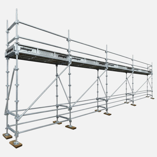 Yakka Gear 5m reach slim Kwikstage Scaffolding system in galvanised steel, featuring a 3m platform height, 9.6m overall length and 0.7m slim width, with multiple scaffold bays, guardrails, diagonal bracing, adjustable base jacks and Yakka Gear branded components, designed for construction and elevated access applications across Australia.