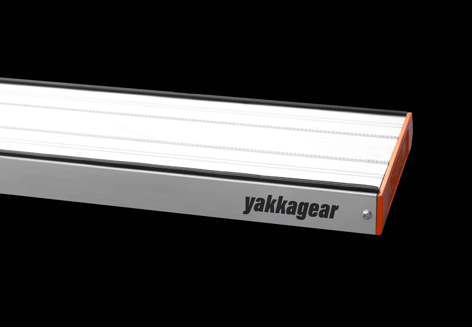 Close-up of Yakka Gear aluminium plank with removable aluminium end cap, set against a black background. The image highlights the precision-fit end cap and anti-slip surface of the lightweight plank, made from 6063-T6 alloy. Dimensions: 228mm wide, 45mm high, 2mm thick with 250kg load capacity