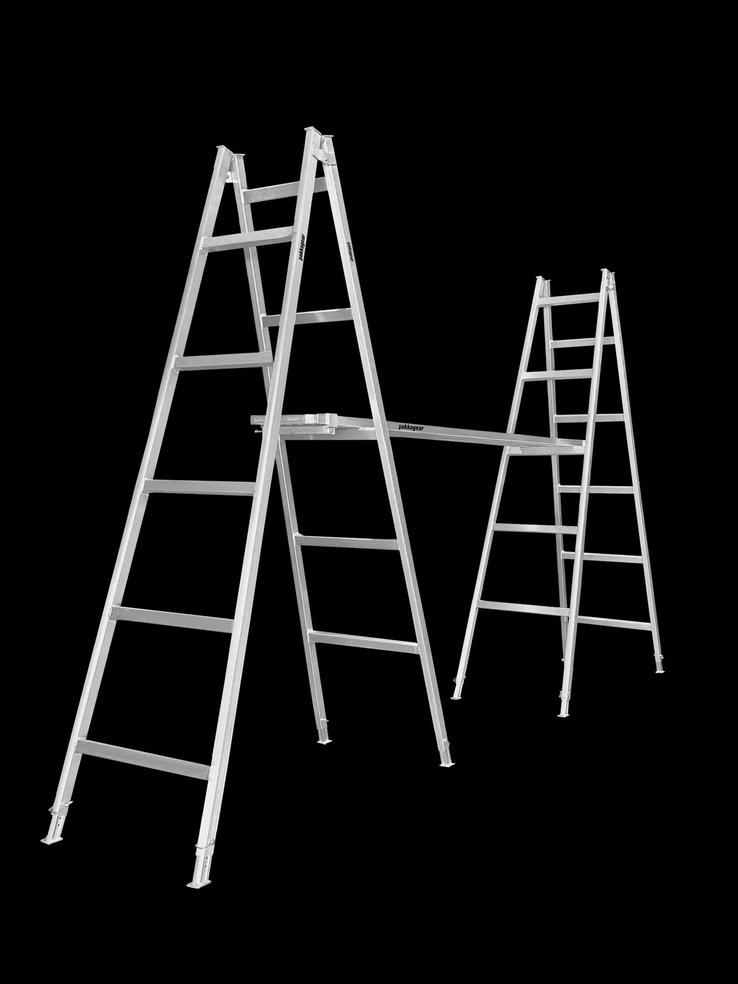 Aluminium planks positioned on adjustable aluminium trestles against a black background, forming a stable elevated platform. Commonly used by Australian tradies for tasks like painting, cladding, rendering, and general construction. The setup features anti-slip planks with removable end caps and height-adjustable trestles for flexible, on-site access. Plank Clamps are used to securely join two planks together, improving overall stability and reducing flex during use.