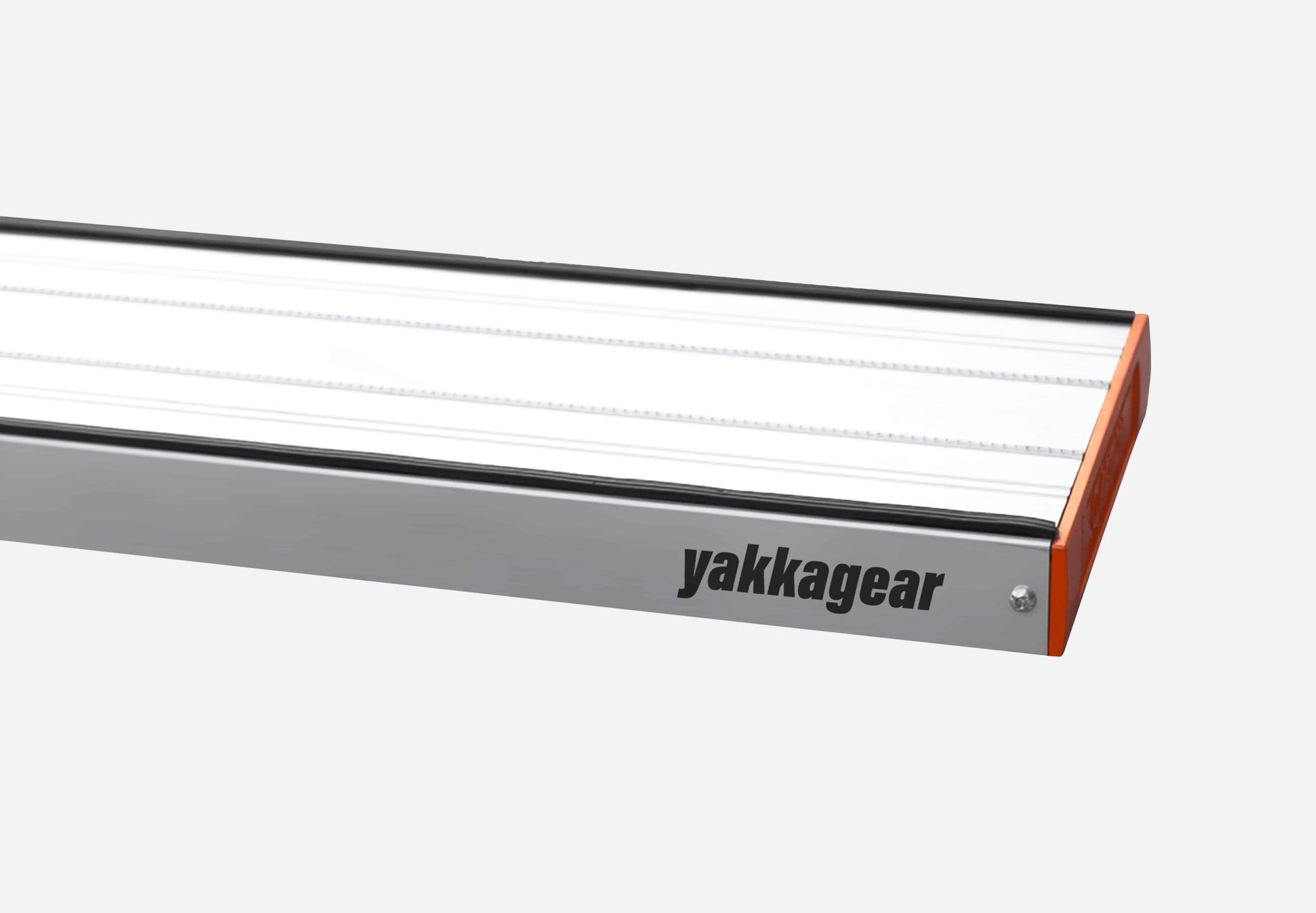 Close-up of Yakka Gear aluminium plank with removable aluminium end cap, set against a white background. The image highlights the precision-fit end cap and anti-slip surface of the lightweight plank, made from 6063-T6 alloy. Dimensions: 228mm wide, 45mm high, 2mm thick with 250kg load capacity