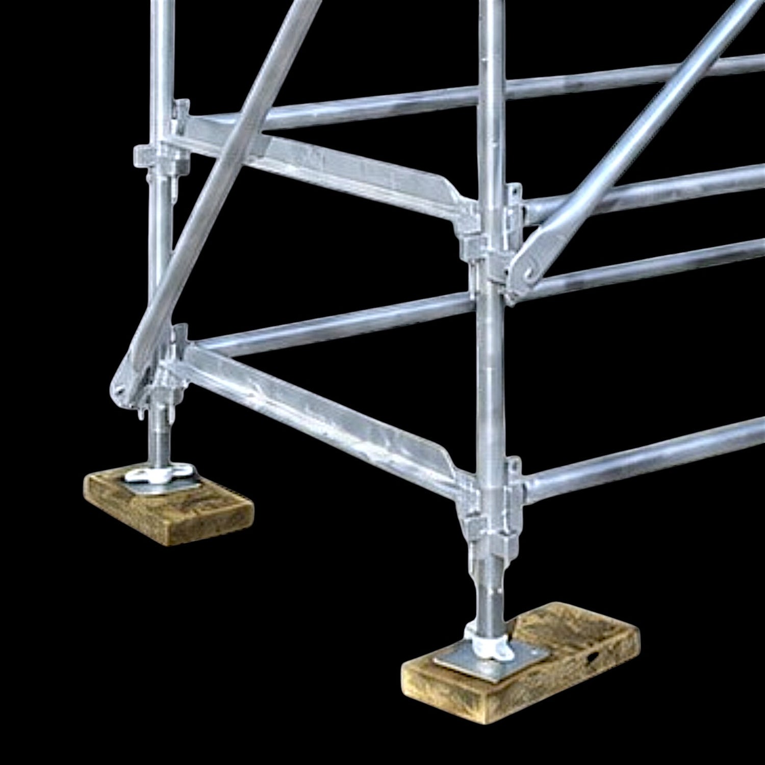 Close-up view of Yakka Gear Kwikstage Scaffolding in galvanised steel, showing vertical standards, ledgers, transoms, diagonal bracing and adjustable base jacks supported on timber sole boards, highlighting the secure base and modular connections used to provide stability for scaffolding systems on construction and building projects across Austral