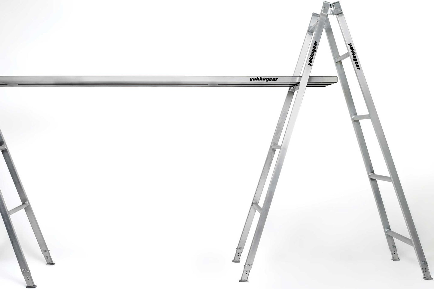 Melbourne Made Adjustable Aluminium A-Frame Trestle Ladders from Yakka Gear. Available in sizes 1.8m, 2.4m, 3.0m, 3.6m, 4.2m, and 4.8m. All adjustable to be higher by 26cm on each leg. Being used with a plank across two trestles.