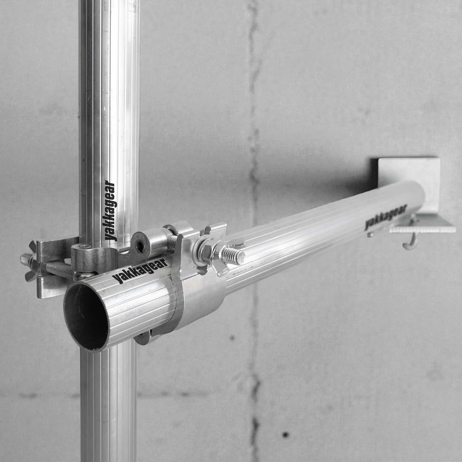 Yakka Gear scaffold wall mount fixed to a wall, clamping onto 50mm–51mm tubing for Slim, Wide, and Compact scaffolds, providing secure support in tight spaces without the need for stabiliser legs or outriggers, Australia.