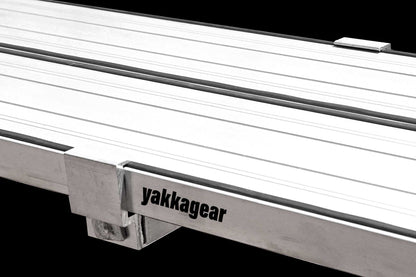 Yakka Gear Australia Plank Clamp being used on two Aluminium Planks as access equipment. Joins two planks together to make the work platform twice as wide and twice as stable. Reduces flex. Used on all sized planks including 2.4m, 3m, 3.6m, 4m, 5m and 6m planks.