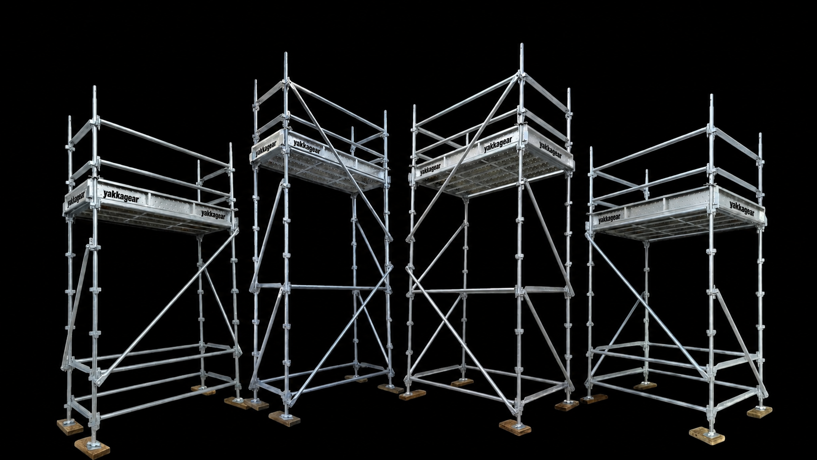 Yakka Gear Kwikstage Scaffolding range in galvanised steel, showing four assembled scaffold towers of varying heights and configurations with working platforms, guardrails, vertical standards, ledgers, transoms, diagonal bracing and adjustable base jacks, designed to provide stable elevated access for construction and building projects across Australia.