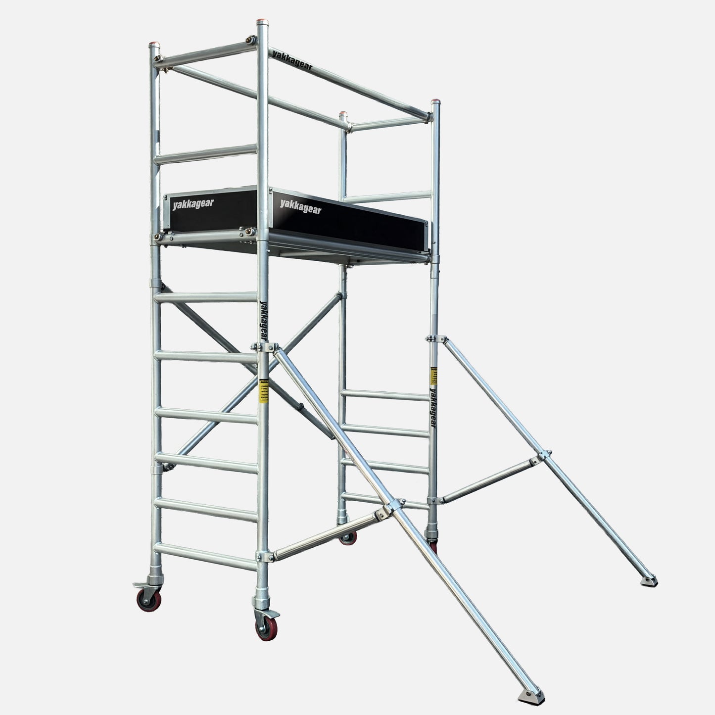 Yakka Gear Australia 4m reach aluminium scaffold tower with 2m working platform height, 0.7m wide x 1.7m long deck, guard rails, stabilising outriggers and portable lockable wheels.