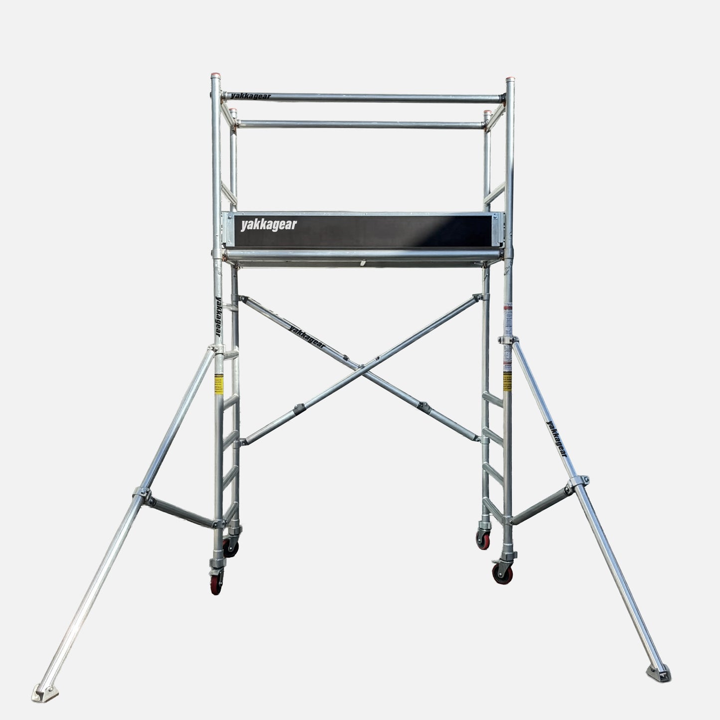 Yakka Gear Australia aluminium mobile scaffolding tower, 0.7m wide x 1.7m long, offering 4m reachability from a 2m platform height with guard rails and outriggers for stable access.
