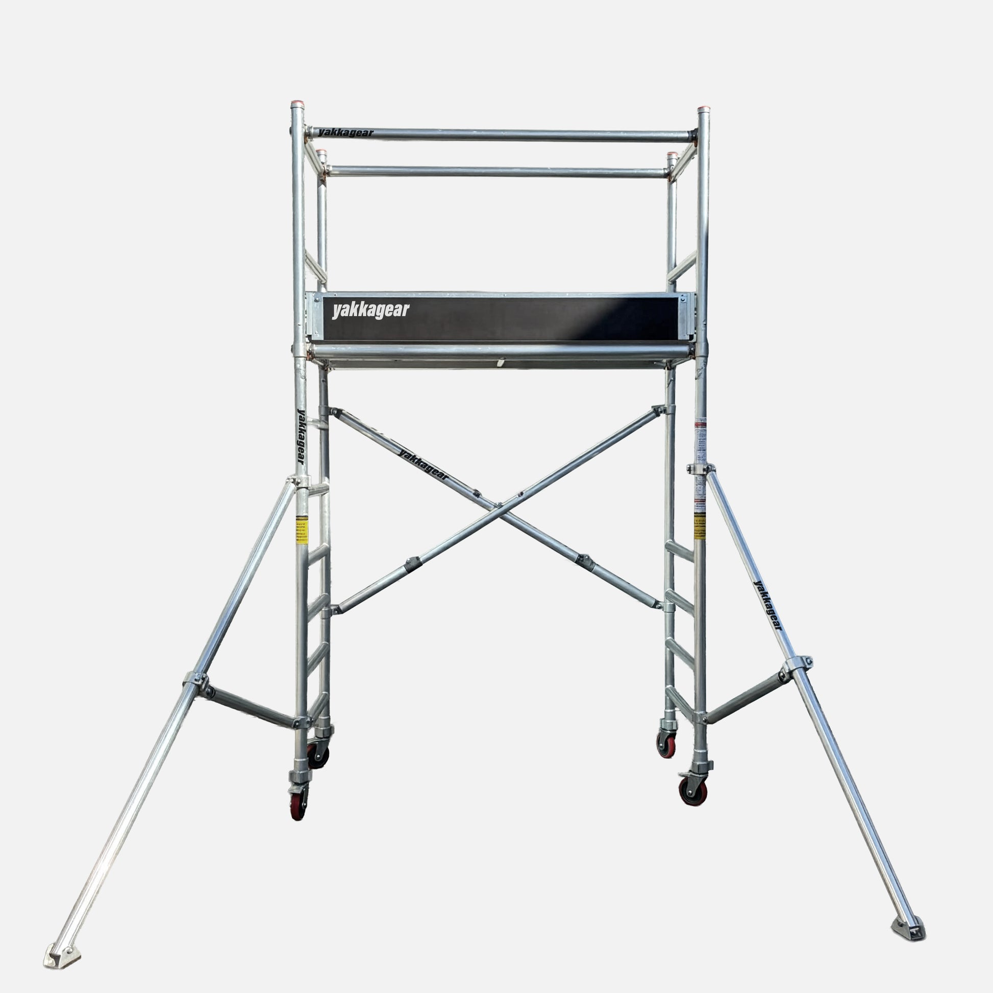 Yakka Gear Australia aluminium mobile scaffolding tower, 0.7m wide x 1.7m long, offering 4m reachability from a 2m platform height with guard rails and outriggers for stable access.